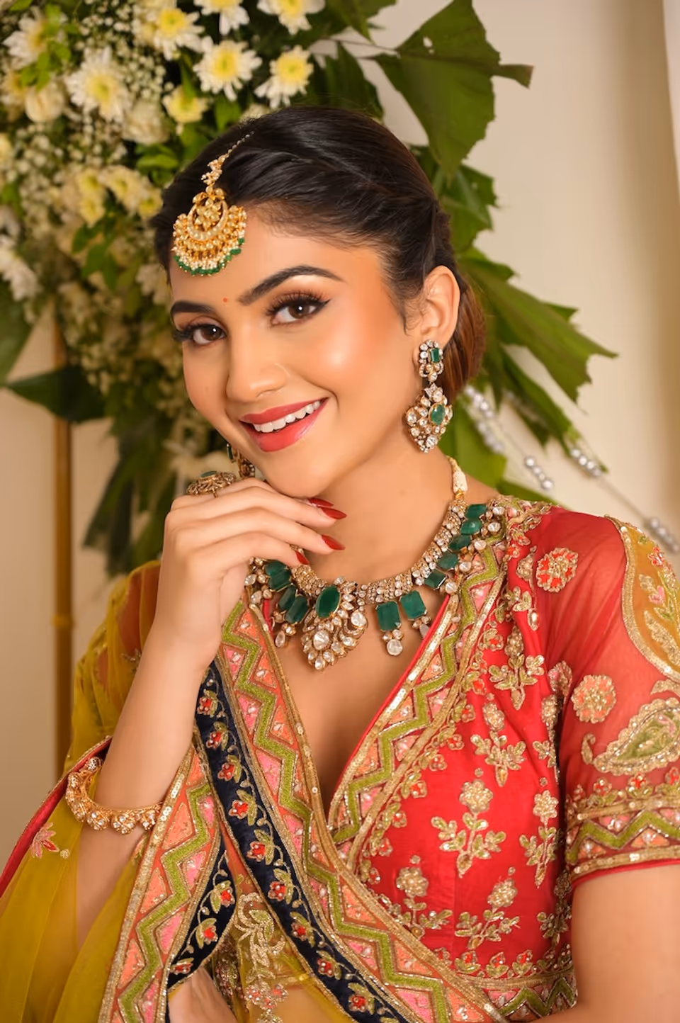 Traditional bridal look with radiant skin and a classic red lip