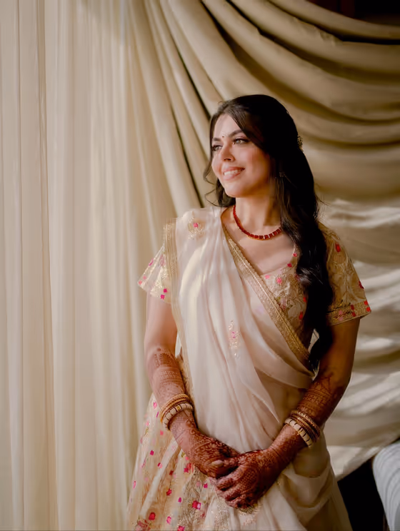 Ivory saree with a soft matte base and minimal jewellery