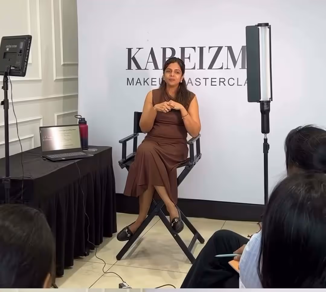 Kareizma seated in the director's chair addressing a batch of students in the Andheri West studio